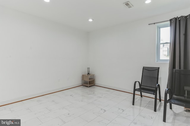 living area featuring light tile floors