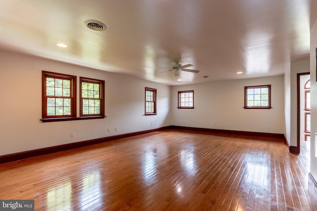 empty room featuring ceiling fan and wood-type flooring