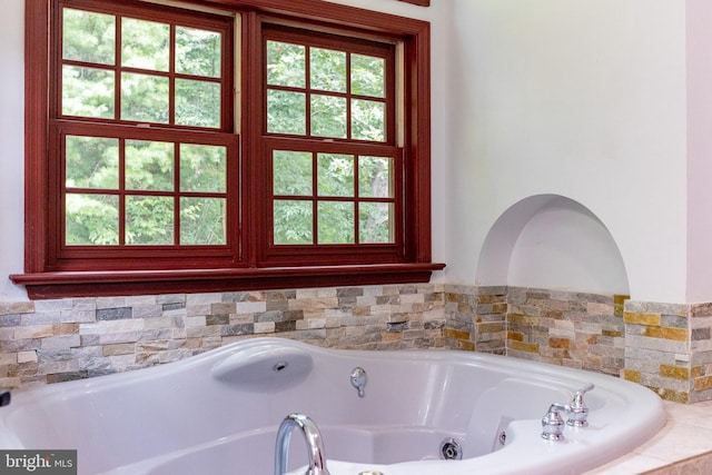 bathroom with tiled tub