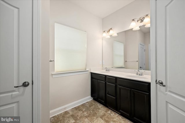 bathroom featuring double sink vanity and tile patterned flooring