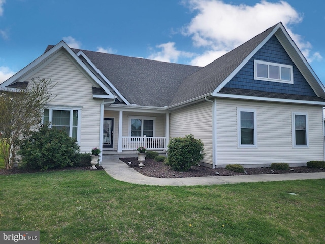 craftsman house with a front lawn and a porch