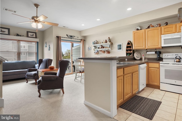 kitchen featuring kitchen peninsula, ceiling fan, white appliances, and light tile flooring