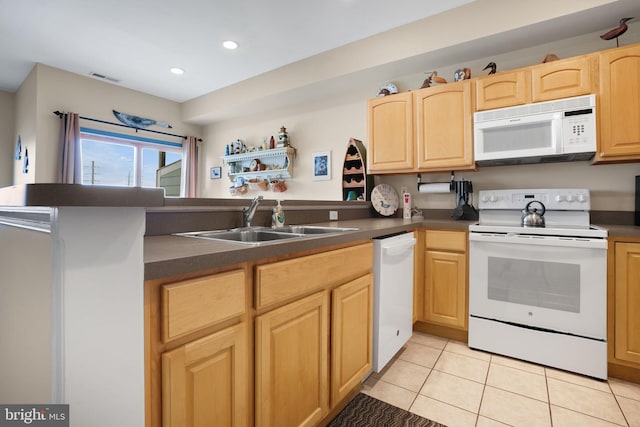 kitchen featuring light tile floors, kitchen peninsula, white appliances, and sink