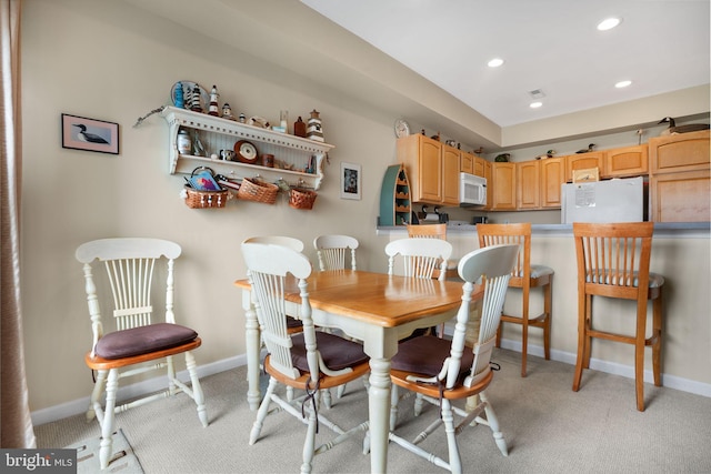 view of carpeted dining area