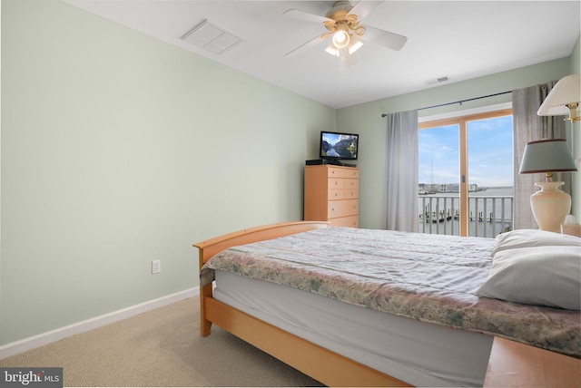 carpeted bedroom with ceiling fan and access to outside