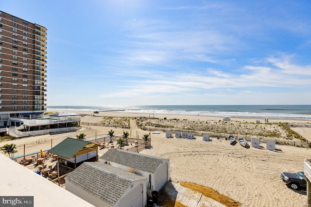 bird's eye view with a beach view and a water view