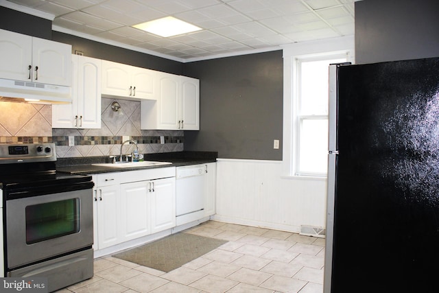 kitchen featuring white cabinetry, appliances with stainless steel finishes, sink, and decorative backsplash