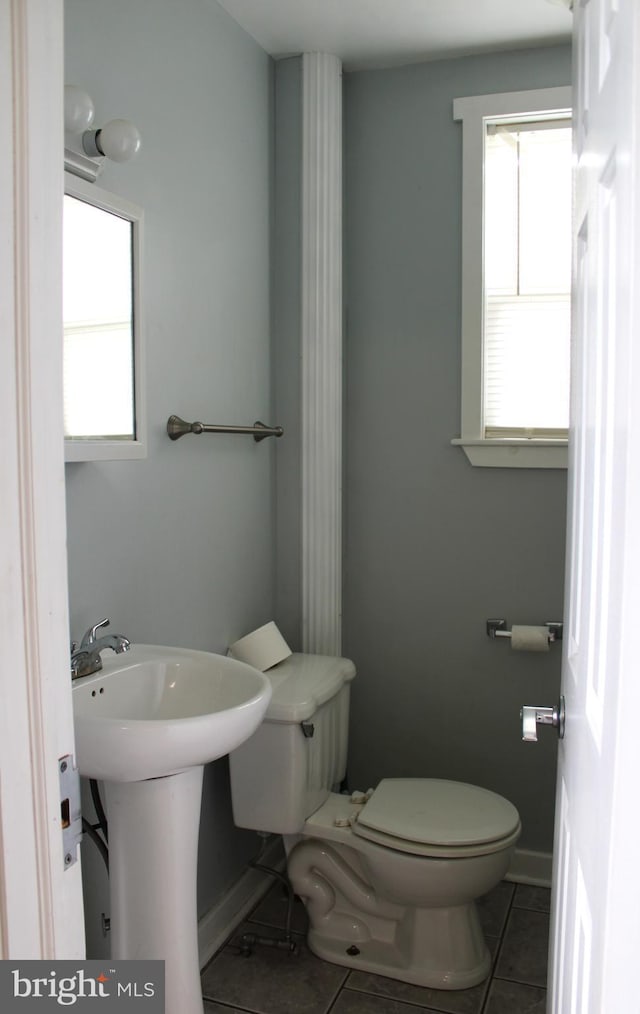 bathroom featuring tile patterned flooring and toilet