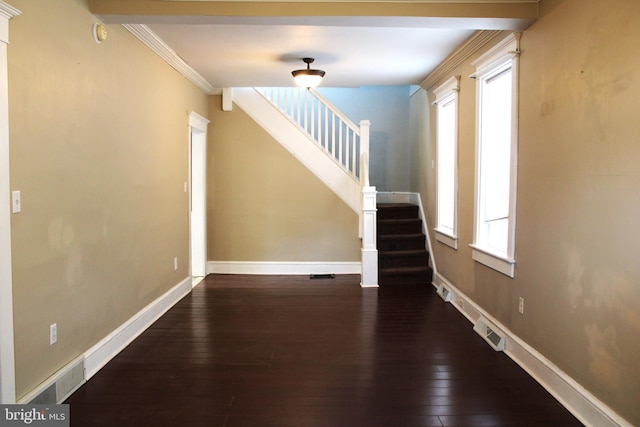 interior space with wood-type flooring, ornamental molding, and a wealth of natural light