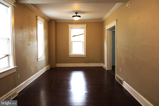 unfurnished room with ornamental molding and dark hardwood / wood-style flooring