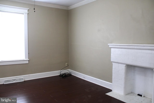 unfurnished room featuring hardwood / wood-style flooring and ornamental molding