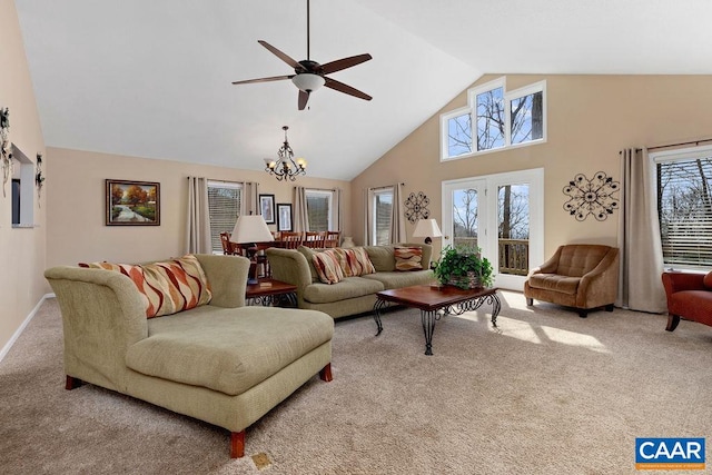 carpeted living room featuring high vaulted ceiling, french doors, and ceiling fan with notable chandelier