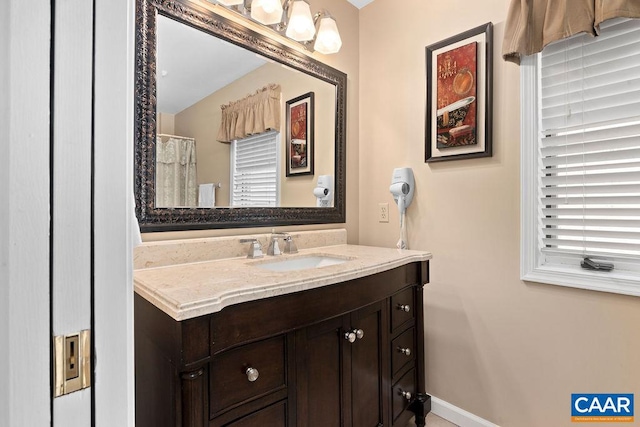 bathroom featuring vanity with extensive cabinet space