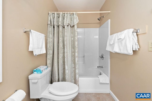 bathroom featuring shower / bath combo, tile floors, and toilet