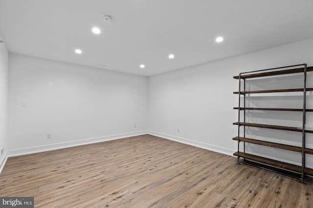 spare room with light hardwood / wood-style flooring