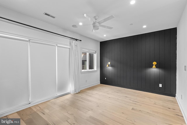 unfurnished bedroom featuring light hardwood / wood-style floors and ceiling fan