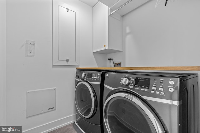 clothes washing area with cabinets, separate washer and dryer, washer hookup, and dark tile floors