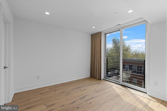 unfurnished room featuring light wood-type flooring