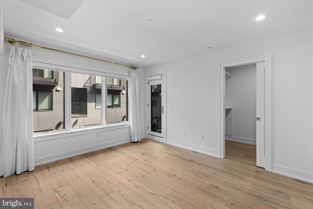 spare room with light hardwood / wood-style floors