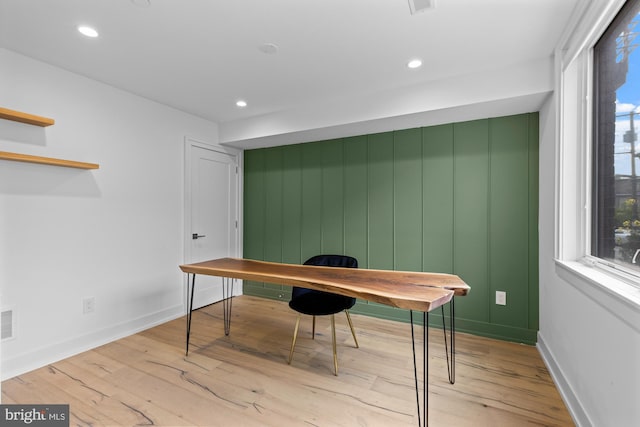 office area with light hardwood / wood-style floors