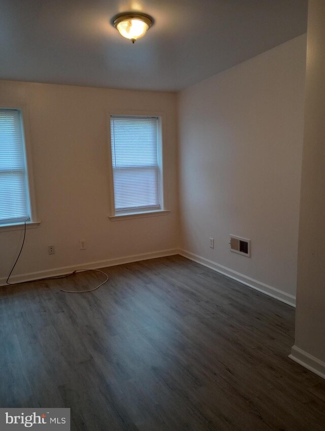 empty room featuring dark hardwood / wood-style floors