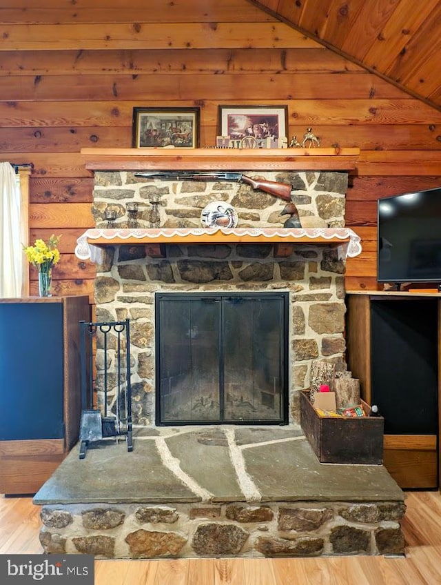 details featuring wood-type flooring, wooden ceiling, and a fireplace