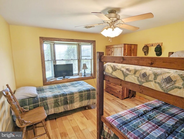 bedroom with ceiling fan and light hardwood / wood-style floors