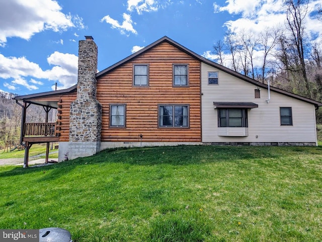 back of house featuring a lawn