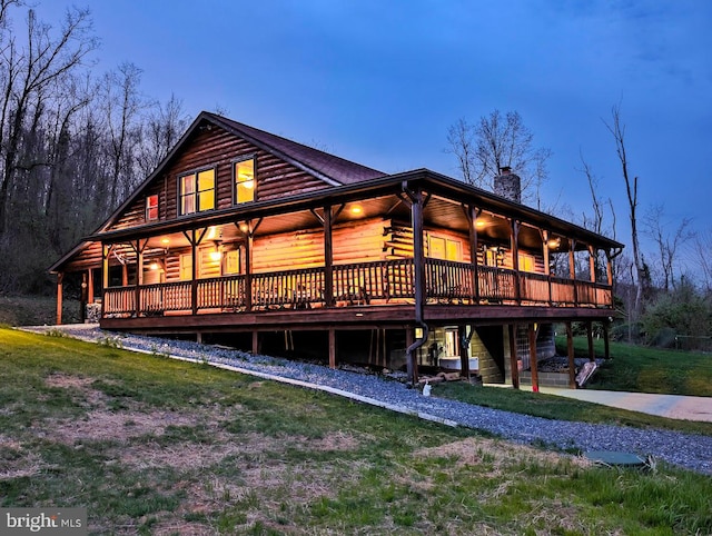 back of house with a yard and a deck