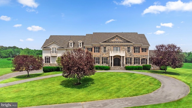 colonial home with a front yard