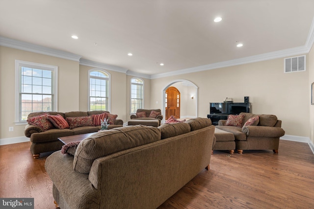 living room with crown molding and dark hardwood / wood-style flooring