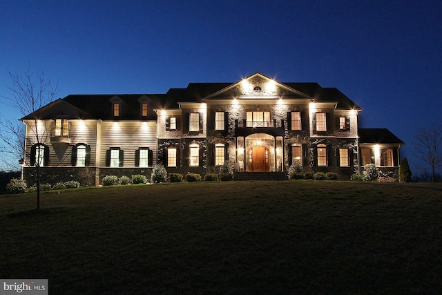 greek revival inspired property featuring a yard