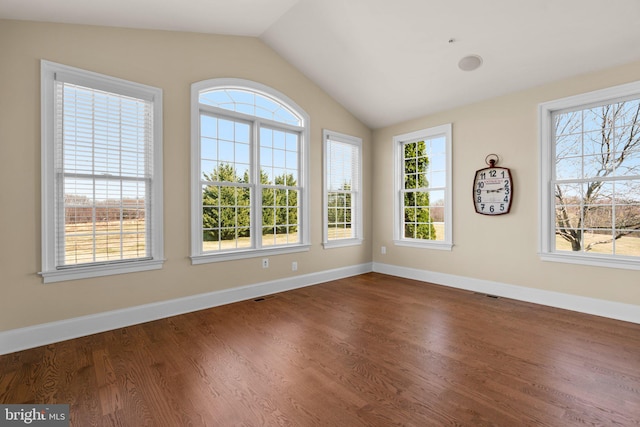 unfurnished sunroom featuring lofted ceiling