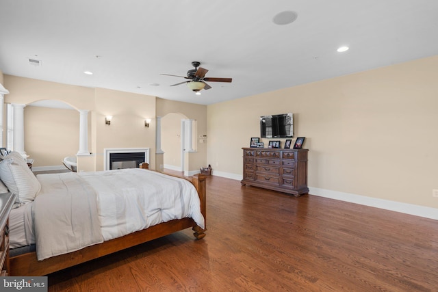 bedroom with ceiling fan and dark hardwood / wood-style flooring