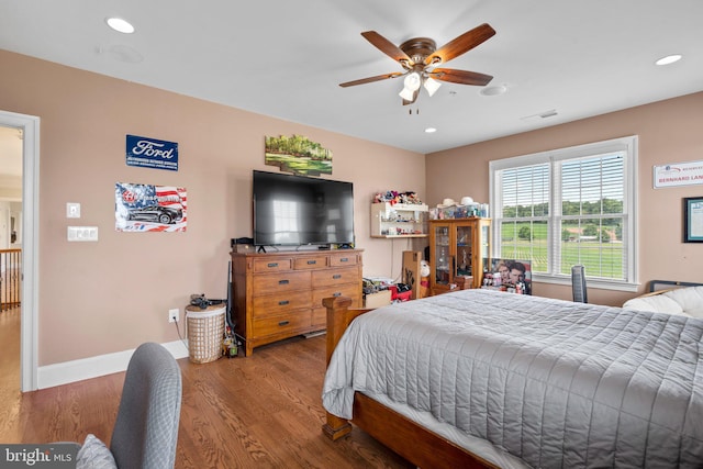 bedroom with wood-type flooring and ceiling fan