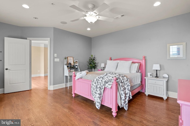 bedroom with hardwood / wood-style floors and ceiling fan