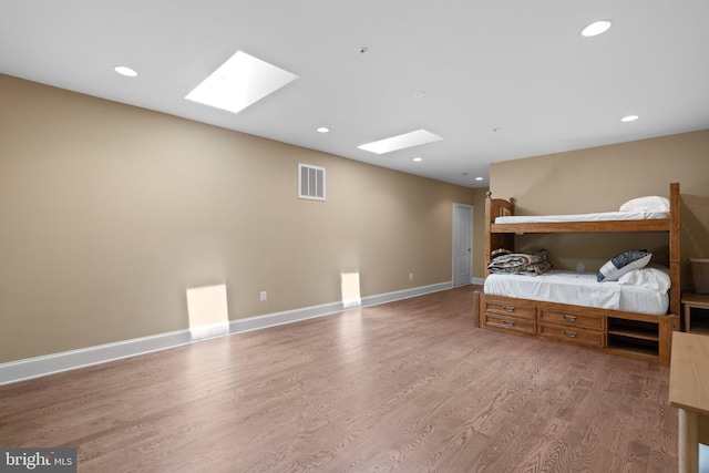 bedroom with hardwood / wood-style flooring