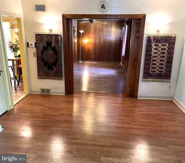 hall with dark hardwood / wood-style floors