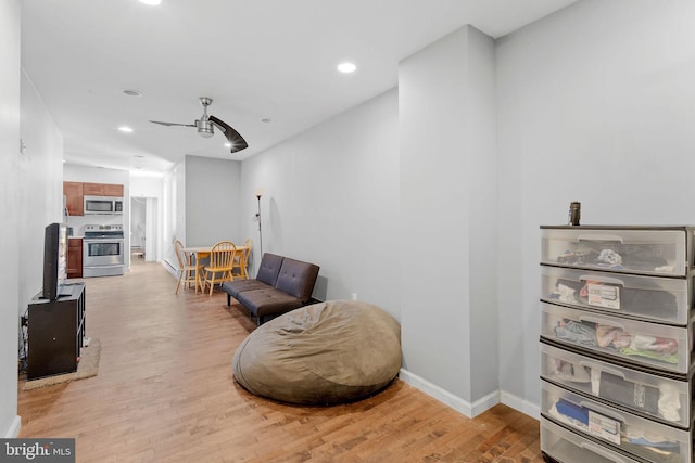 living area with light hardwood / wood-style flooring