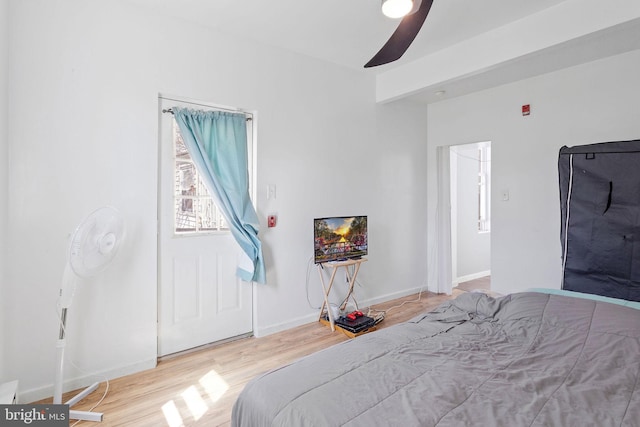 bedroom with ceiling fan and light wood-type flooring