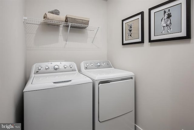 washroom with separate washer and dryer