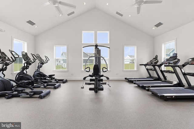 workout area with ceiling fan and high vaulted ceiling