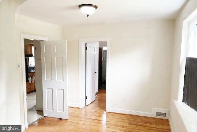 unfurnished bedroom featuring light hardwood / wood-style floors