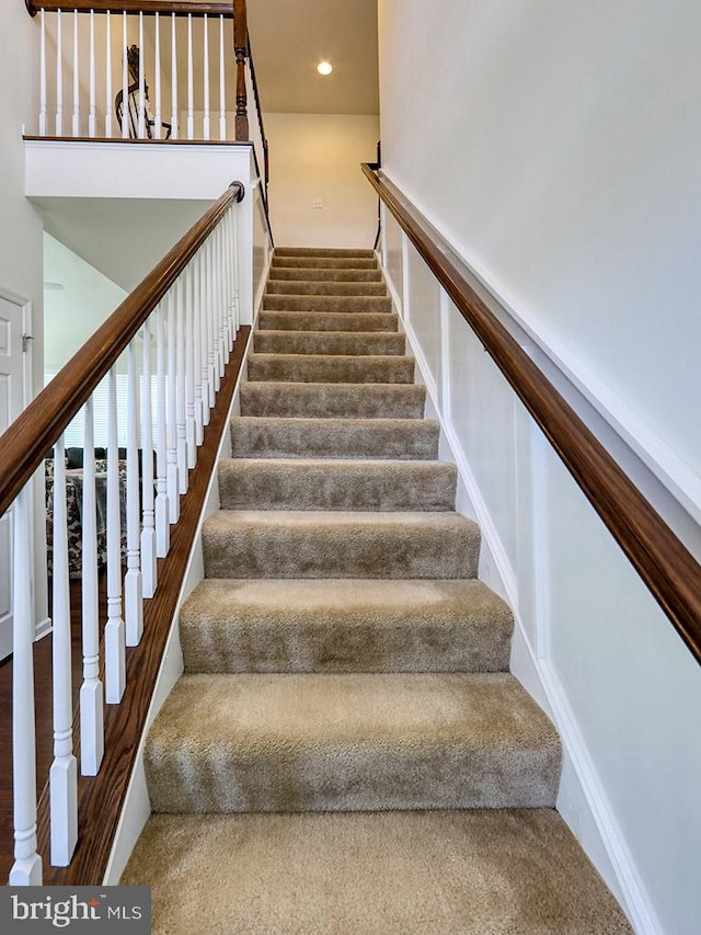 stairway with a towering ceiling