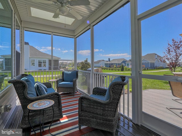 sunroom with ceiling fan and a healthy amount of sunlight