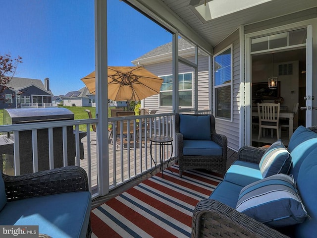 sunroom / solarium featuring a skylight