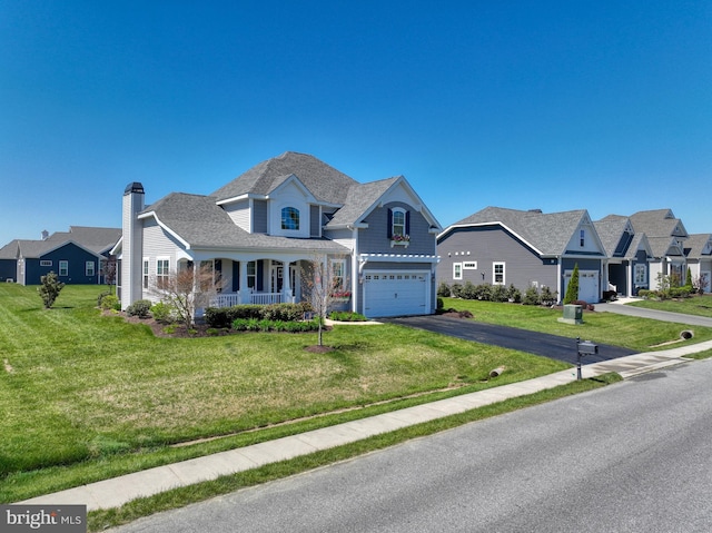 view of front of house with a front yard and covered porch