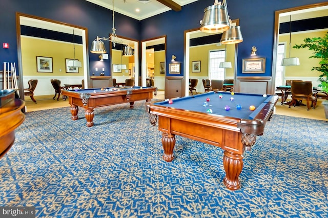 rec room with billiards, a high ceiling, beam ceiling, carpet floors, and ornamental molding