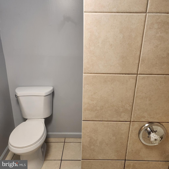 bathroom with toilet and tile flooring