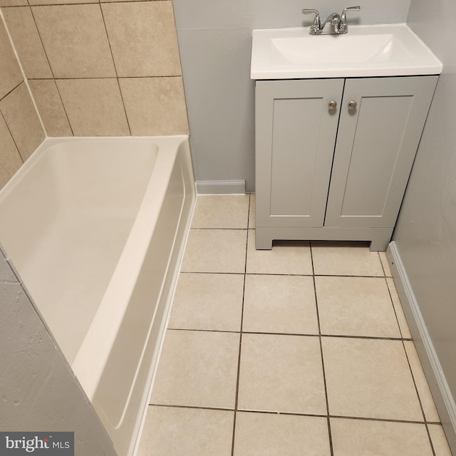 bathroom featuring tile flooring and vanity